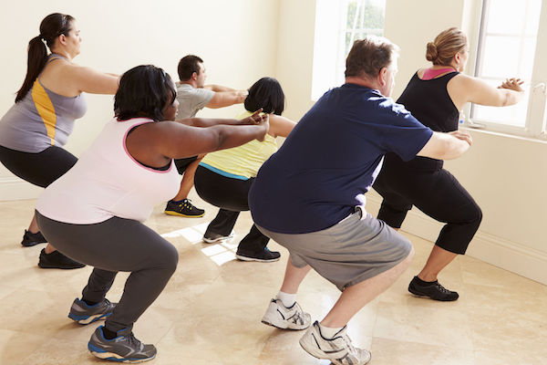 A group of large people exercising