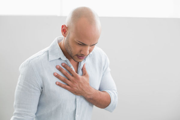 A man in pain from acid reflux