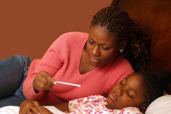 A mother and child with a thermometer