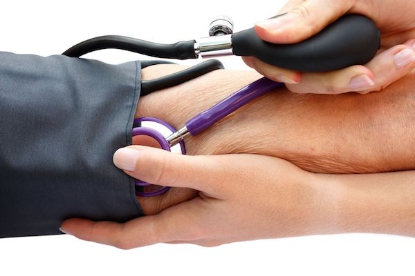 A person having their blood pressure checked