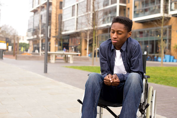 A young man with MS in a wheelchair