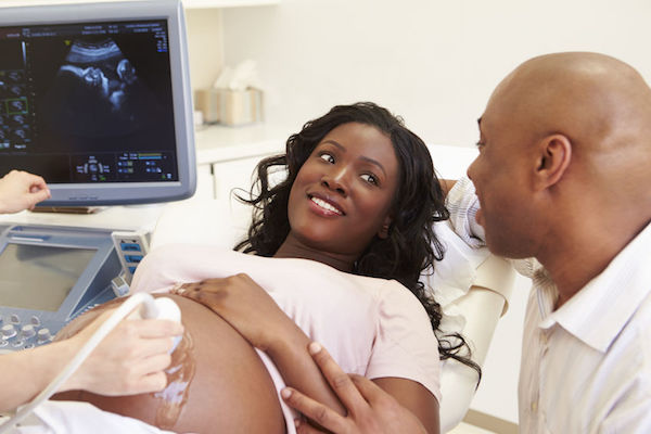 A pregnant woman having an ultrasound